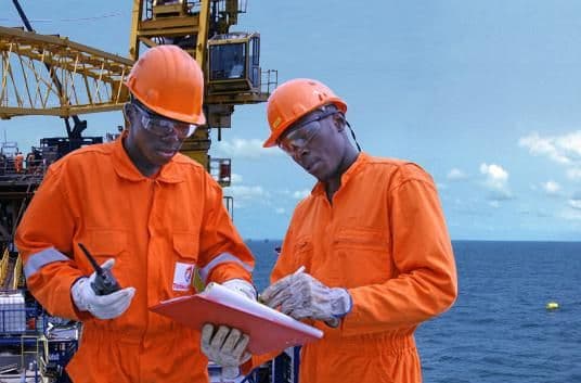 Virgin Forest Energy field engineers reviewing operations offshore
